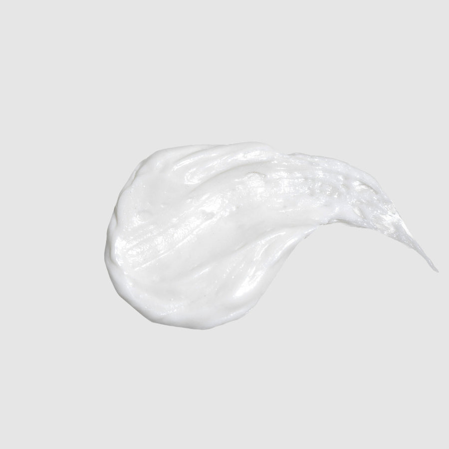 Close-up smear of body butter showing rich, creamy texture