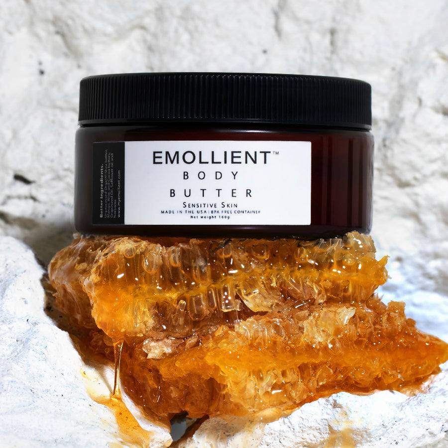 Sensitive skin body butter resting on a bed of natural beeswax